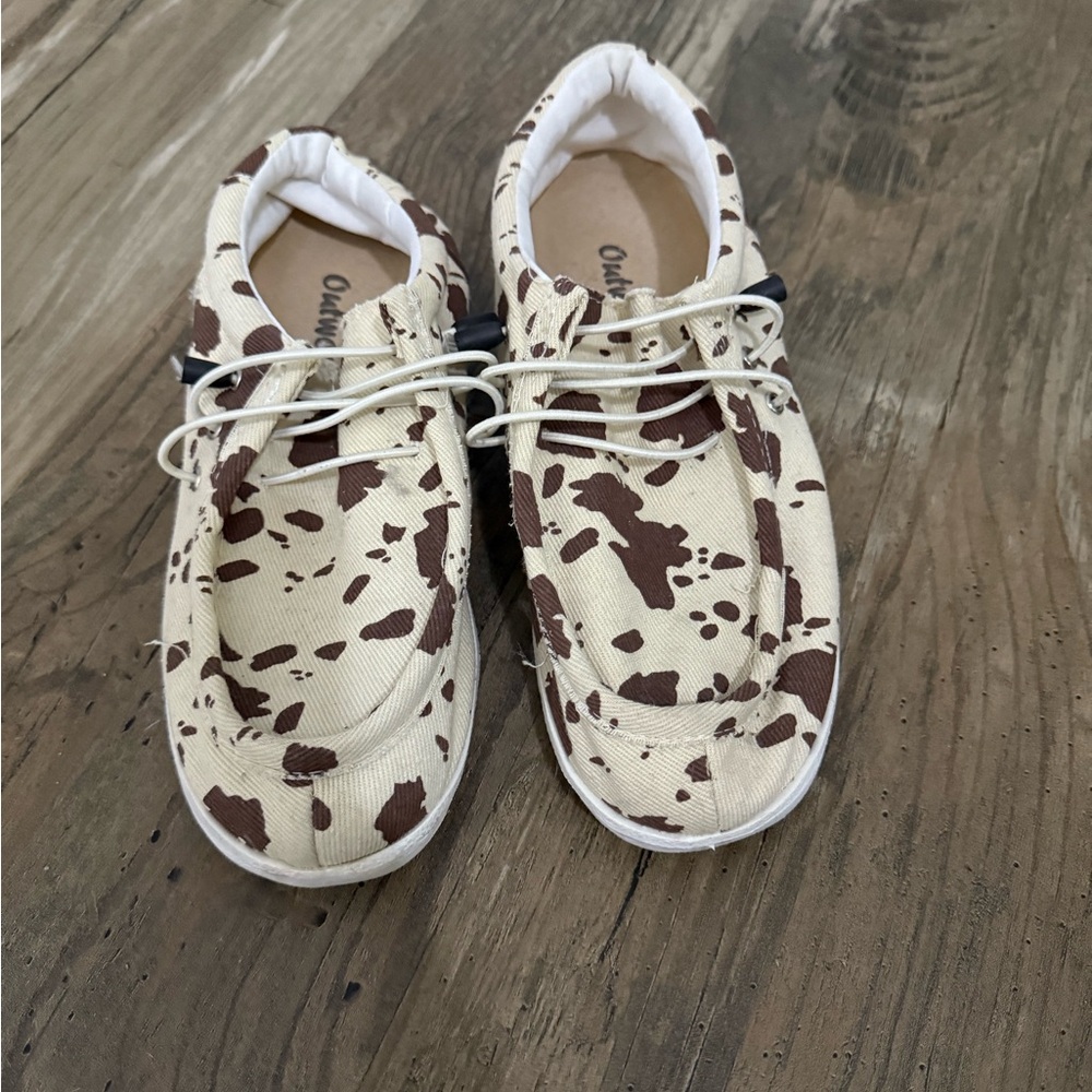 Boutique slip on cow print “hey dudes”